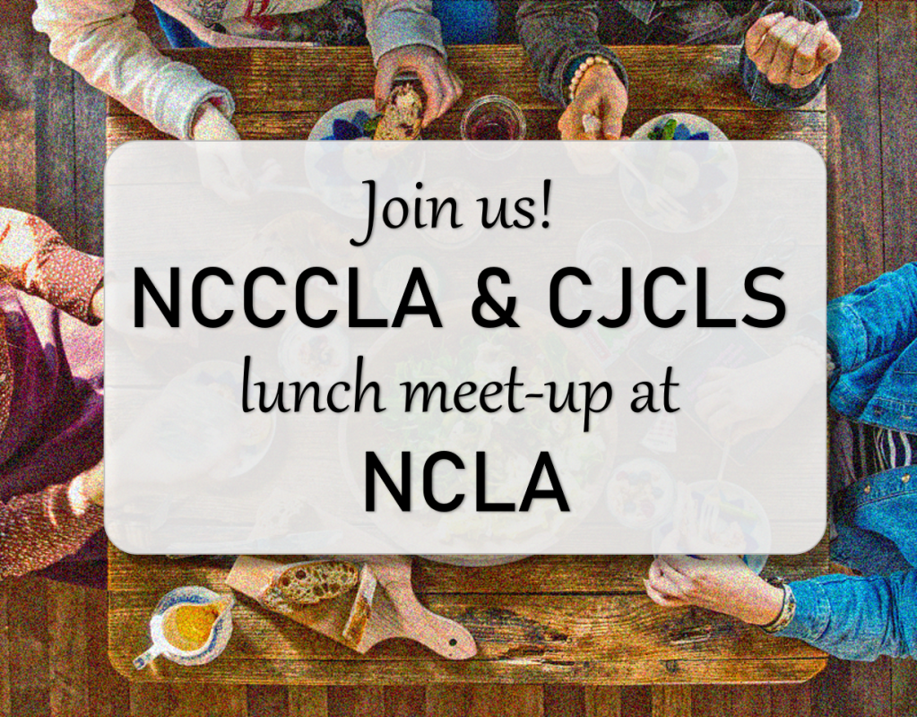 People gathered around a table eating.